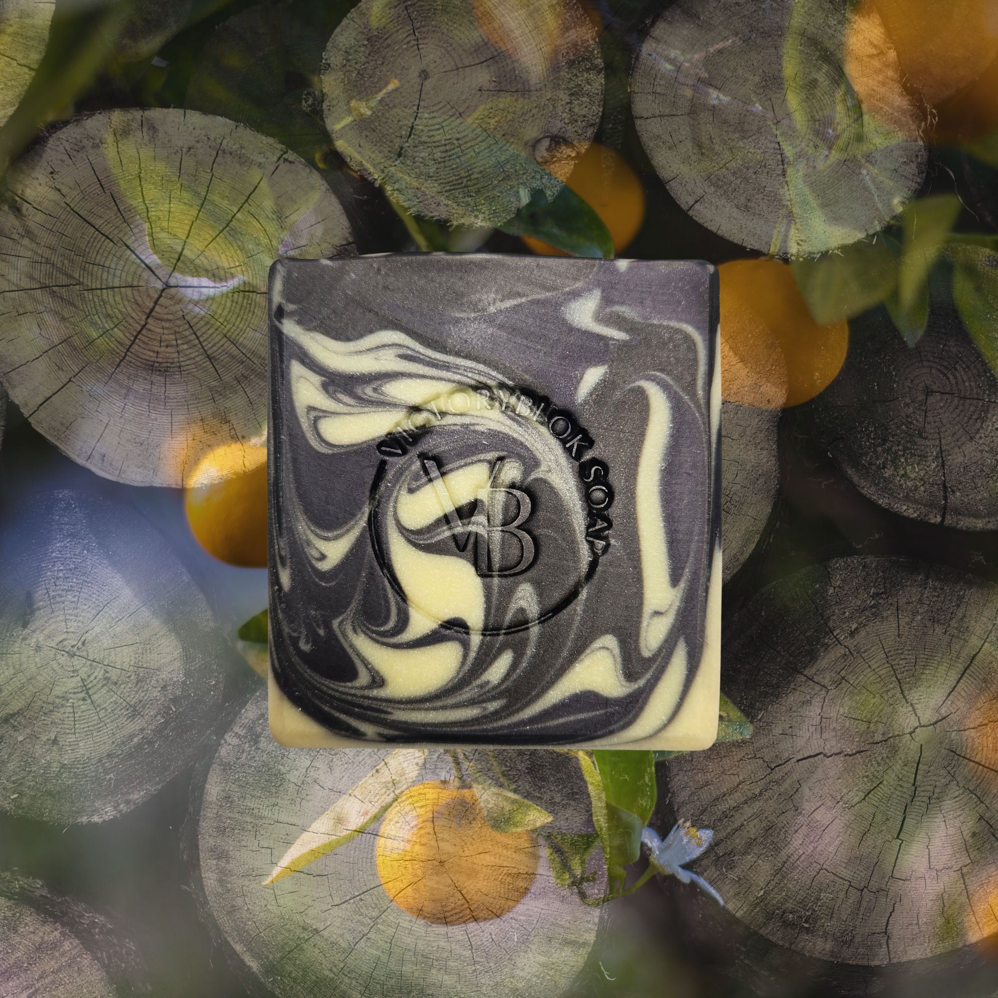 Citrus Midnight natural soap bar with deep charcoal and bright citrus tones, handcrafted with clays, botanicals, and essential oils.