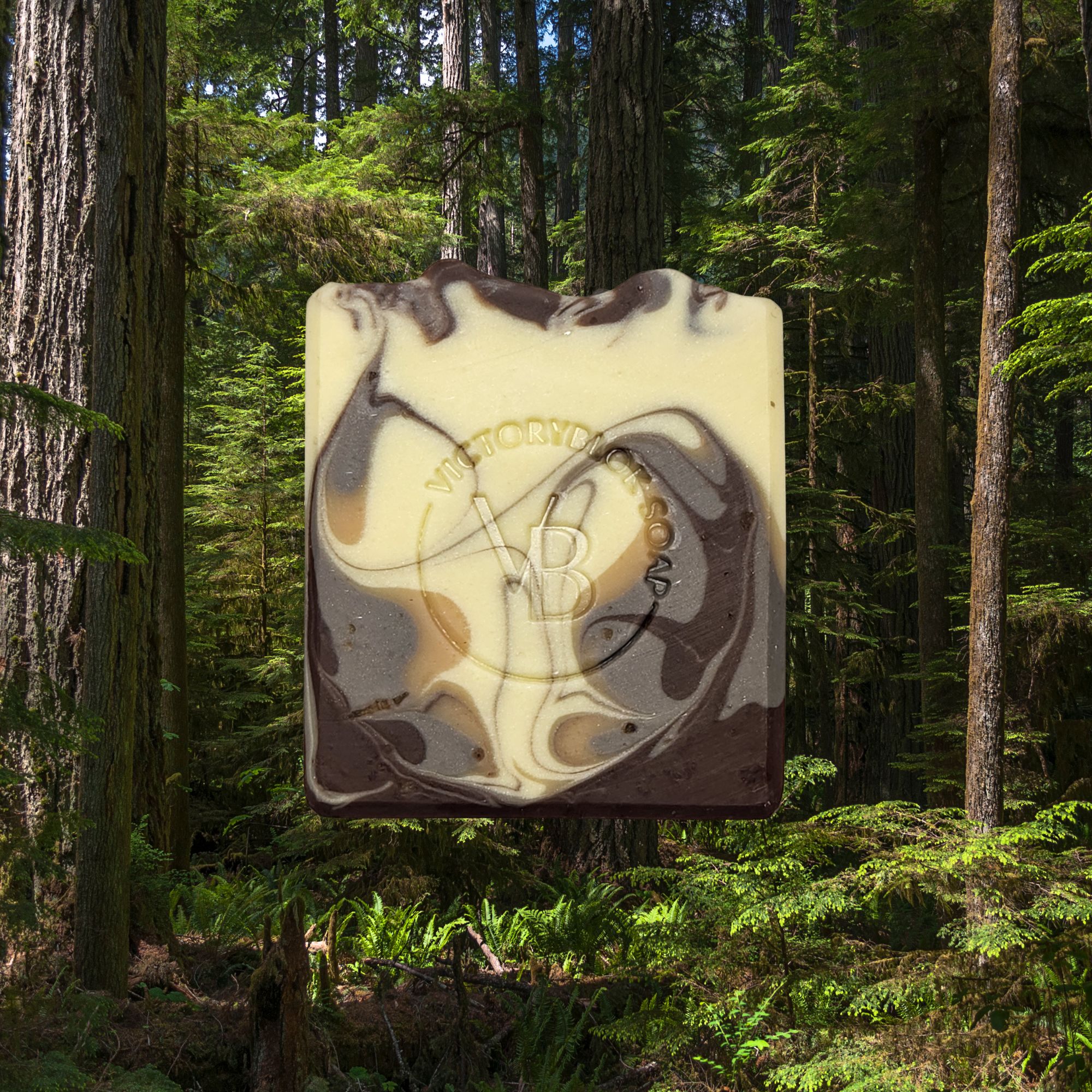 Stonepetal Rise natural soap bar with soft clay tones and charcoal accents, handcrafted with nourishing plant oils and a floral‑earth essential oil blend.