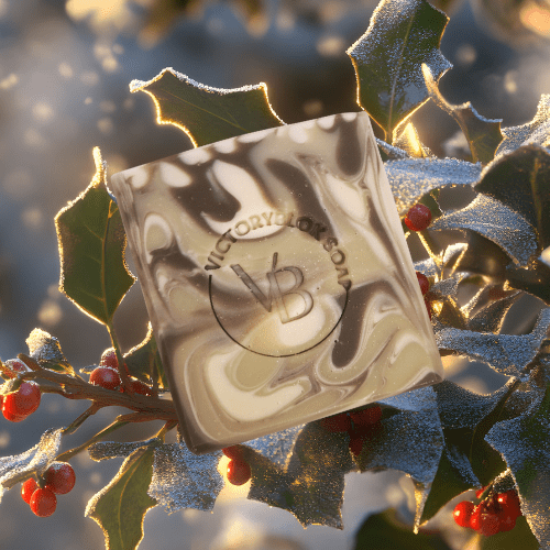 VICTORYBLOKS HOLLY FERN soap bar with green, brown, and cream camouflage-like swirls, set in front of holly leaves and berries. Made with olive oil, coconut oil, green and brown clays, and a blend of essential oils for a fresh, earthy cleanse.